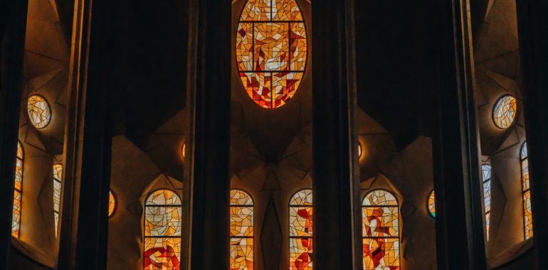 Intricate stained glass windows inside Sagrada Familia, Barcelona.